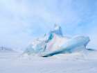 Iceberg in the frozen Mohnbukta in Sabine-Land. Spitzbergen in the Svalbard. Scandinavia, Norway. Art Print